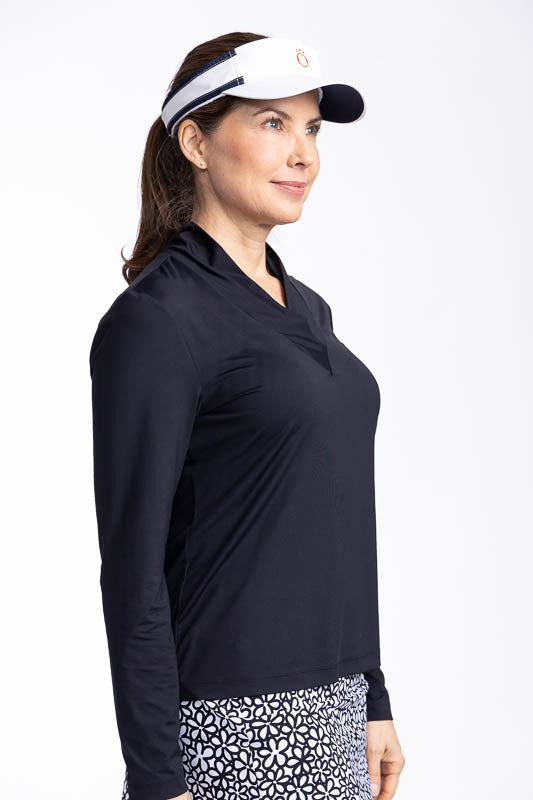 Right side view of the Lovely Layer Long Sleeve Golf Top in Black and the No Hat Hair Visor in white.