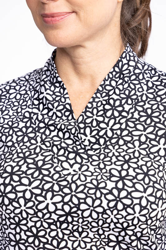 Close front view of the neckline on the Lovely Layer Long Sleeve Golf Top in Fall Bloom print.