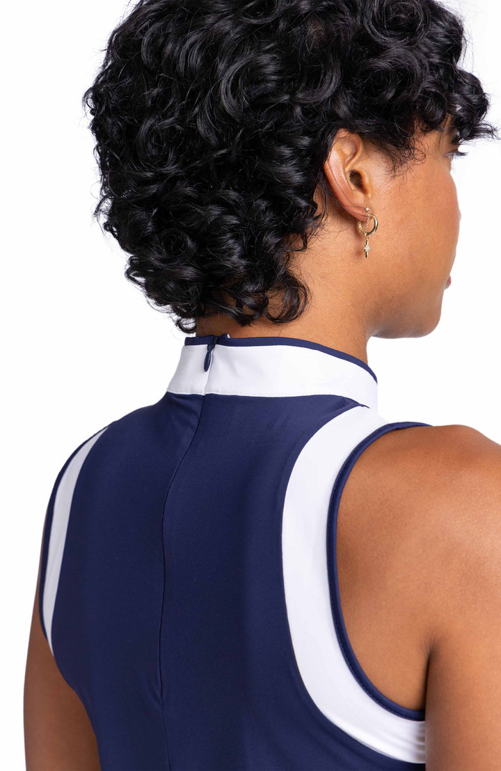 Close view of the center back zipper on the Knock Out top in Navy Blue.