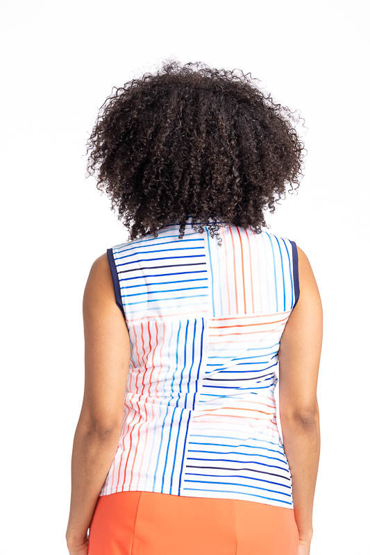 Back view of the Sandy Par Sleeveless Golf Top in Sun Stripe print. The print consists of a mix of horizontal and vertical stripes in coral red, pacific blue, and navy blue on a white back ground with the collar and armholes trimmed in navy blue. This is 