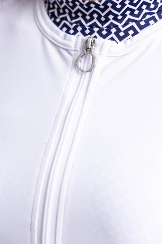 Close front view of the zip front and rounded neckline on the Zip It Up Party Cardi in White. This is a solid white cardi with a zip front, two pockets (one with built-in tee holders), and a rounded neckline.