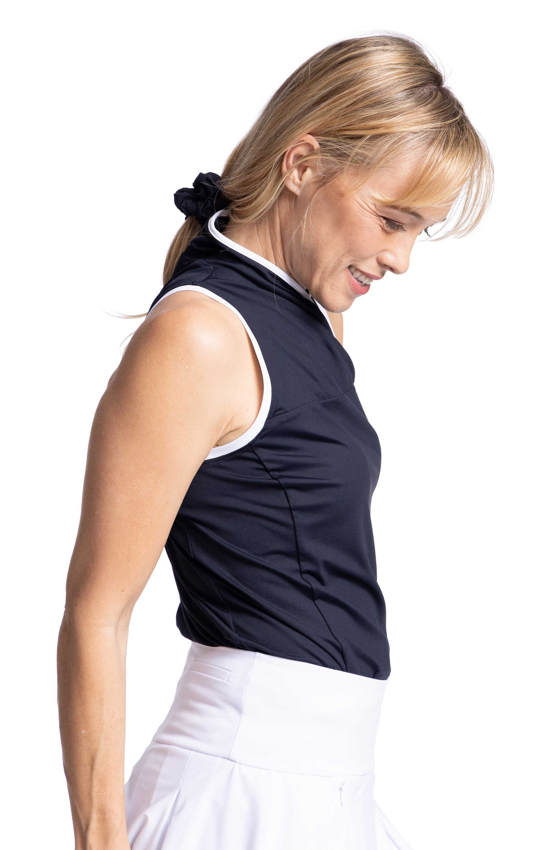 Side view black overlap sleeveless shirt and white skort