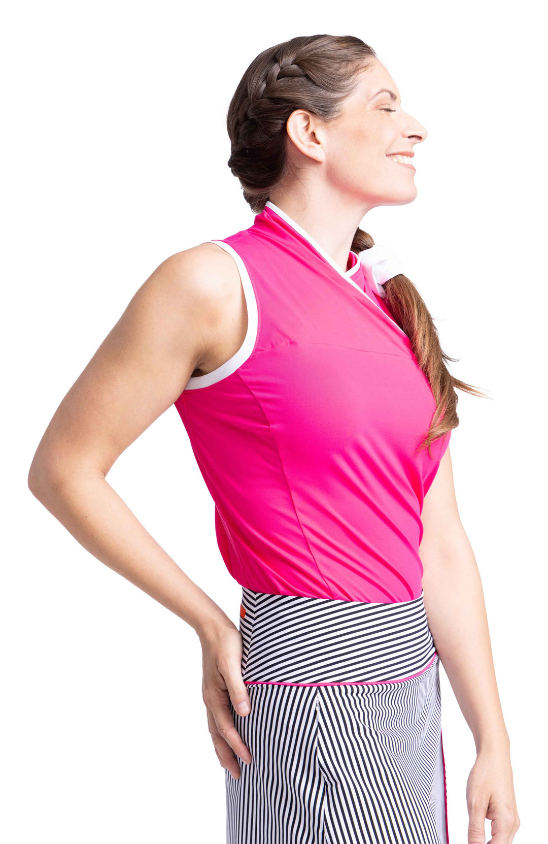 Side view pink overlap sleeveless shirt and black and white striped skort