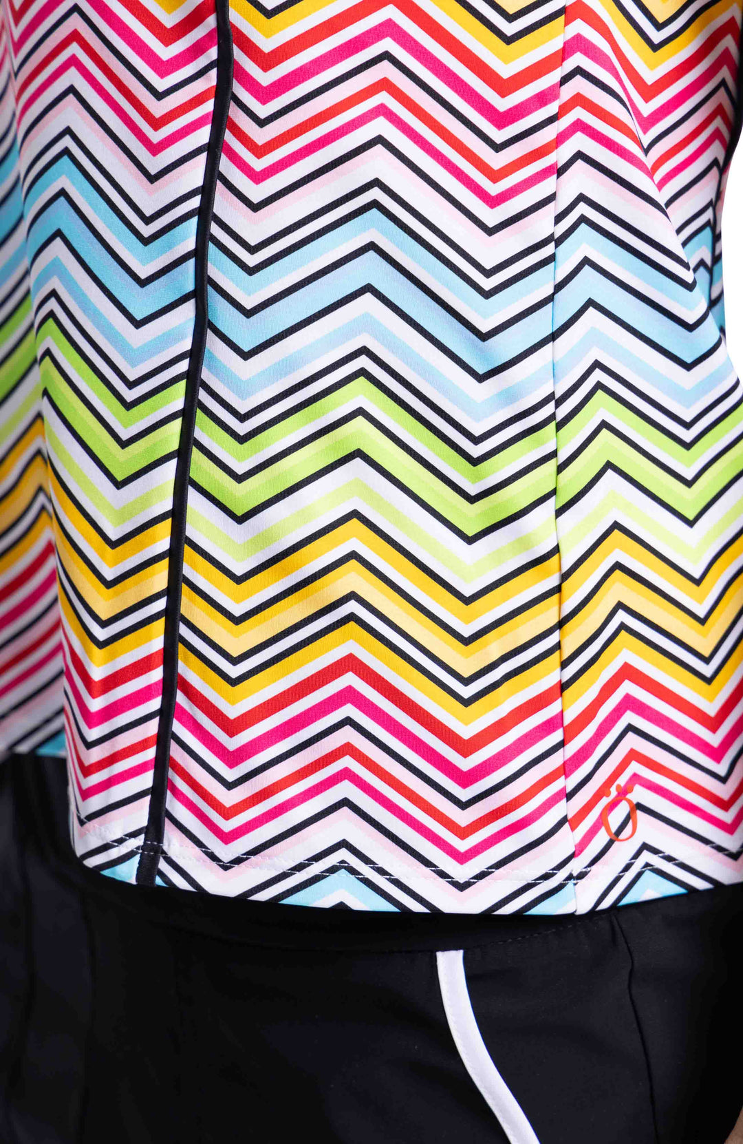 Close up of fabric of TWILIGHT SLEEVELESS GOLF TOP - SUMMER HERRINGBONE pattern in light blue, green, yellow, pink and black