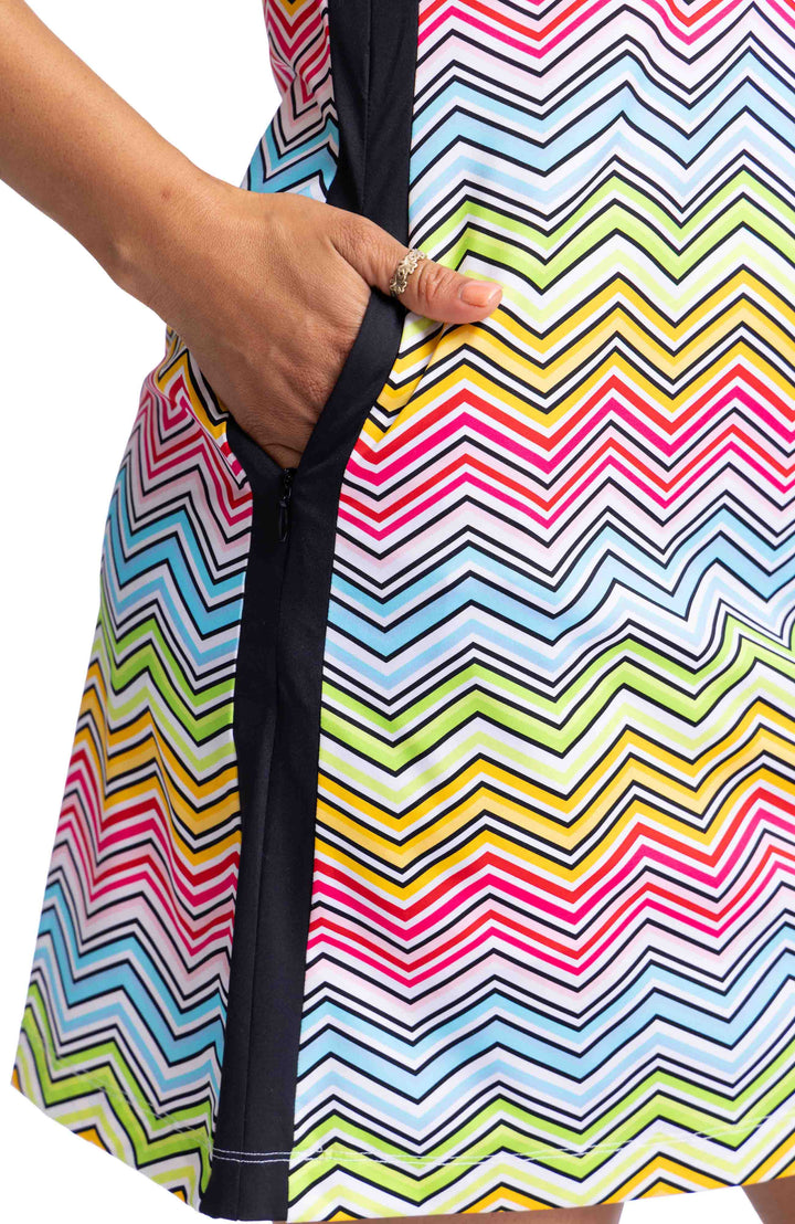 Close up of side pocket of Kinona sleeveless dress in pink, light blue, yellow and black wavy herringbone pattern