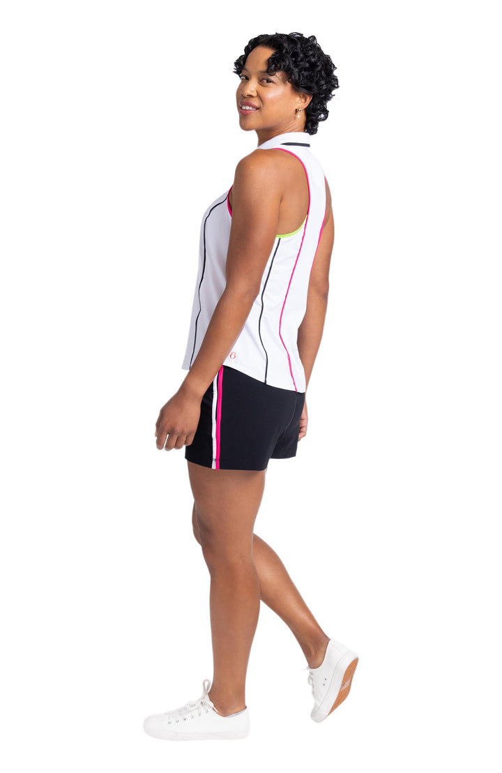 Side view of a woman wearing a sleeveless, racerback top and black shorts with white and pink stripes down the side. 