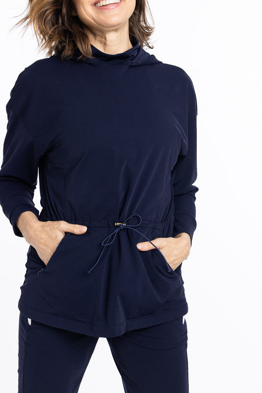 Front view of a woman wearing an Apres 18 Anorak Longsleeve Hoodie in navy blue