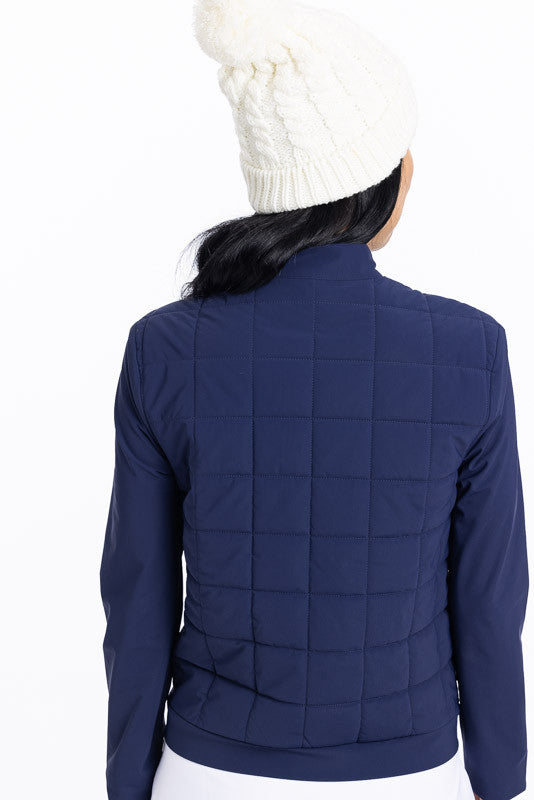 Back view of a woman wearing a navy blue Quilted and Cozy Jacket