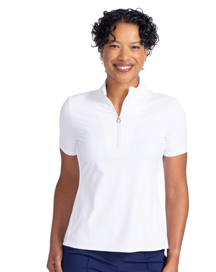 smiling women wearing white shortsleeve keep it covered shortsleeve top with navy shorts