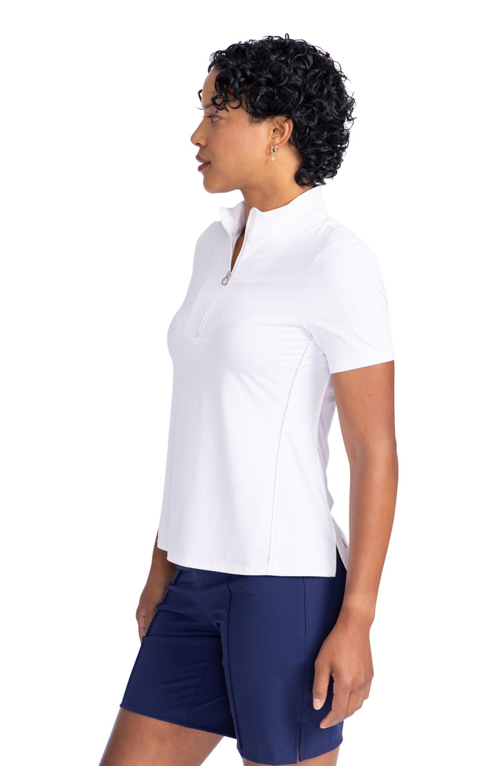 women wearing keep it covered shortsleeve top in white with navy shorts side view