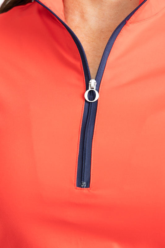 Close front view of the front quarter zip on the Keep It Covered Short Sleeve Golf Top in Tomato Red. 