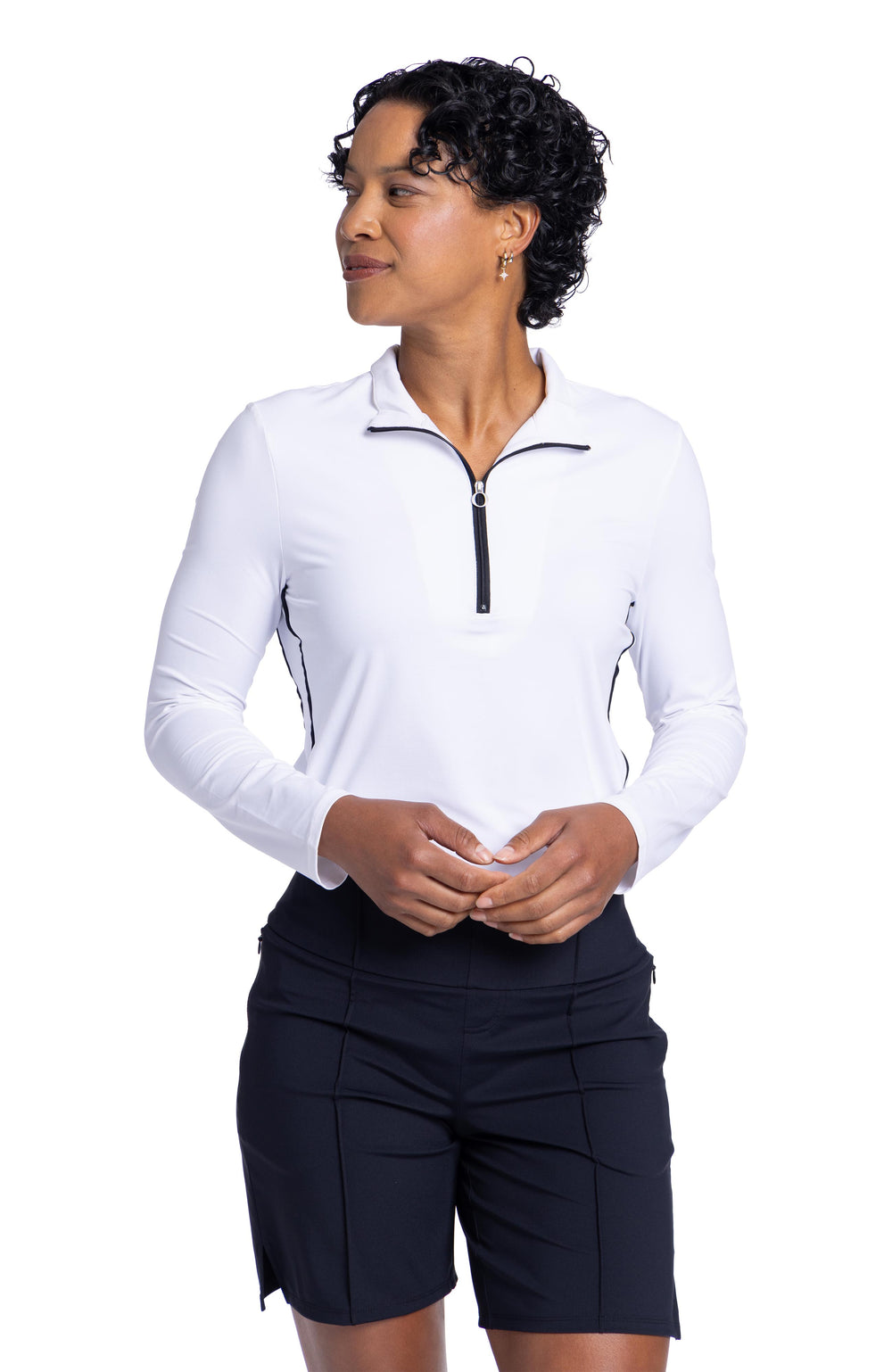 women with longsleeve white keep it covered longsleeve top in white with black trim tucked into a pair of black shorts
