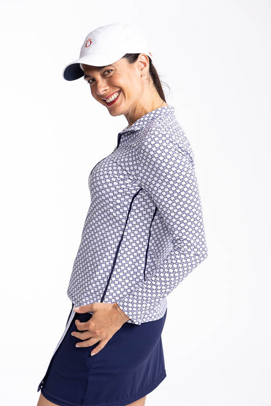 Left side view of the Keep It Covered Long Sleeve Golf Top in Tees Please. This top features a front quarter zipper. When up, the collar stands up; lies flat when partially unzipped.