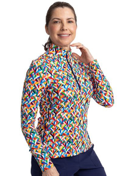 Close front view of a smiling woman wearing the Keep It Covered Long Sleeve Golf Top in K All Day Print.