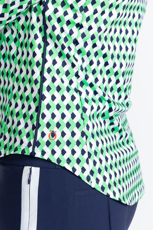Close left side view of the hemline on the At The Pin Long Sleeve Golf Top in Chevron Kelly Green