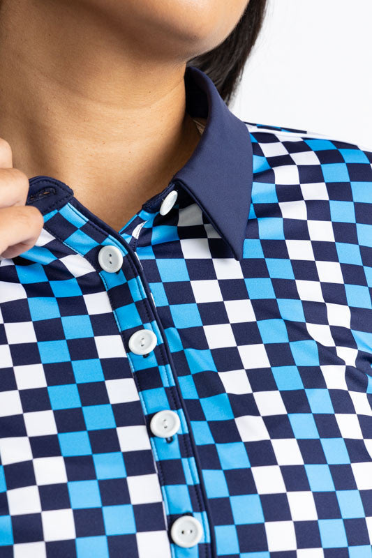 Close front view of the solid navy blue collar and the five button front on the At The Pin Long Sleeve Golf Top in Check It Out print. This print is a mix of French blue, black, and white checks forming a vertical striped pattern. This shirt features a so