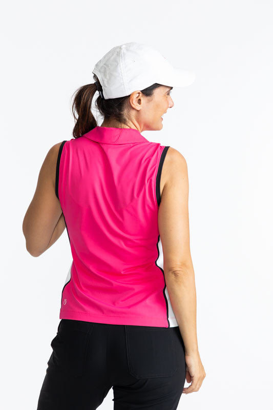 Back view of a woman wearing the We've Got You Covered Hat in White and the Swing Away Sleeveless Golf Top in Preppy Pink. This is a solid Preppy Pink top trimmed in black around each armhole, a white front zipper, and a white side section trimmed with bl