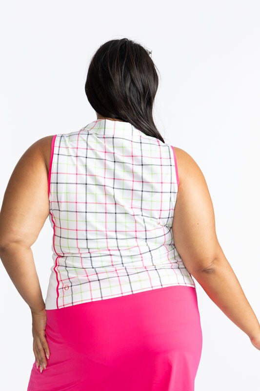 Close back view of the Swing Away Sleeveless Golf Top in Tattersall Plaid. This top is trimmed in Preppy Pink around each armhole, down the front, full-length zipper, and one thin stripe down each side. The print consists of overlapping stripes of Preppy 