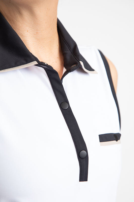 Close front view of the Sun Seeker Sleeveless Golf Top in White. This shirt has black accents around each sleeve, the collar and front snaps as well as a faux front pocket on the left side.