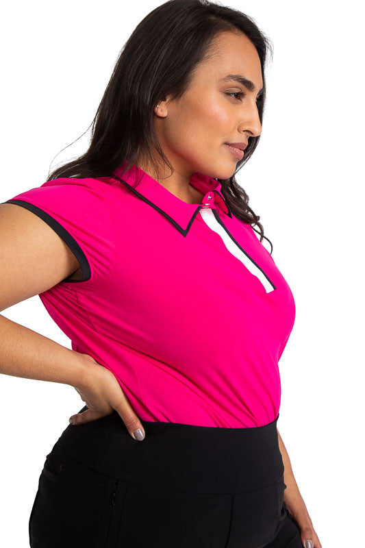 Front and right side of a woman golfer wearing the Up and In Short Sleeve Golf Top in Magenta Pink.