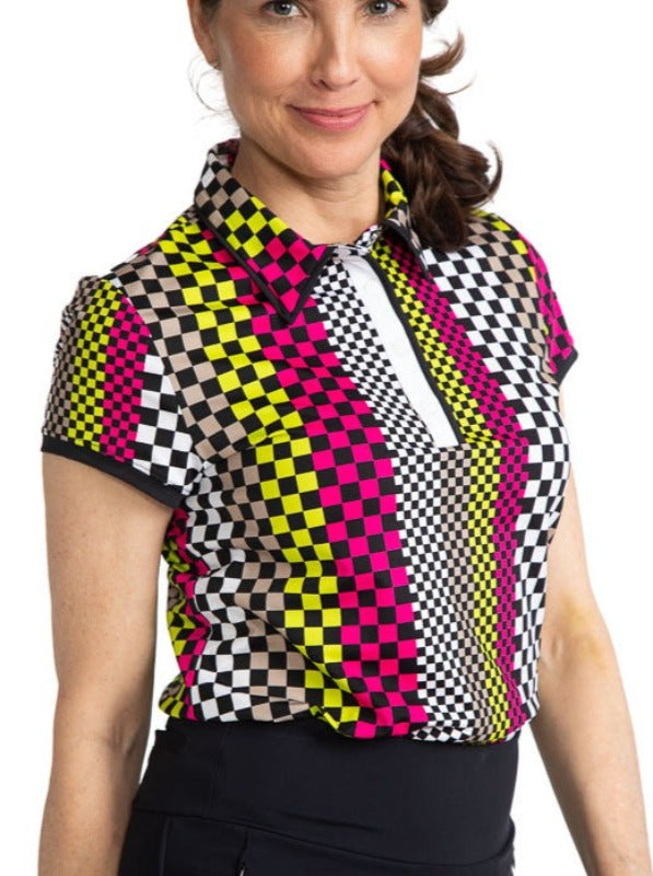 Front view of a smiling woman golfer wearing the Up and In Short Sleeve Golf Top in Checks Mix print.