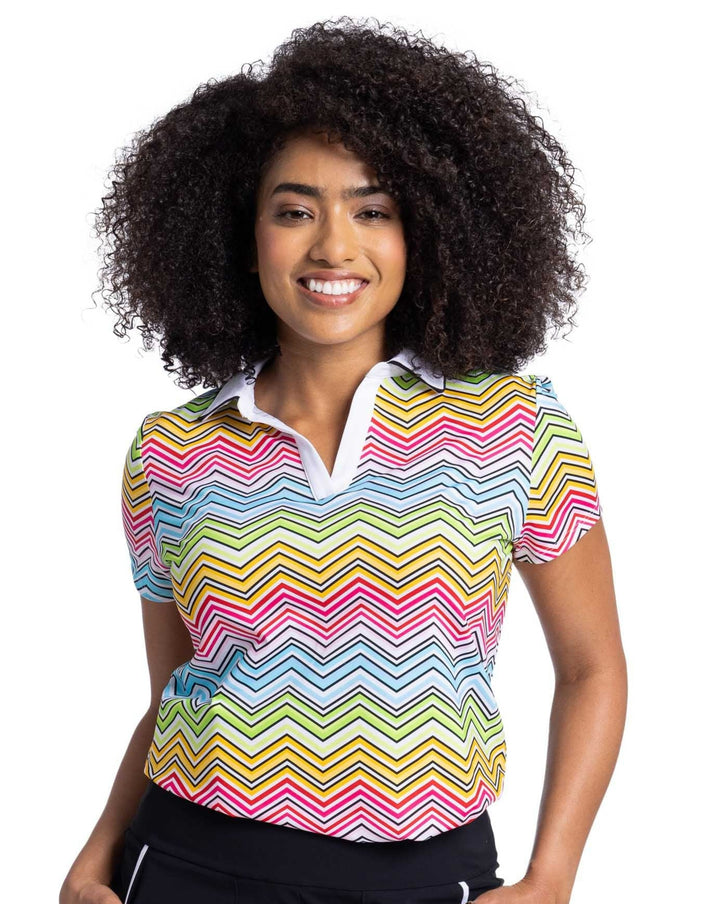 Woman wearing women's golf polo in herringbone wave pattern 