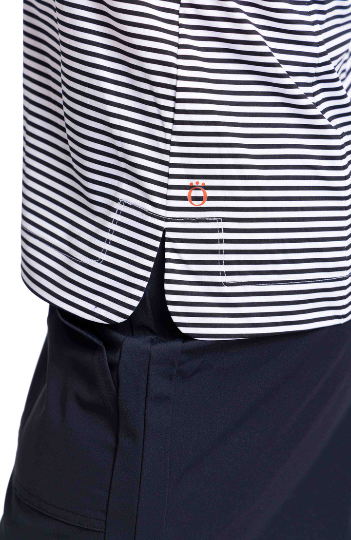 Close up of black and white horizontal striped golf polo hemline