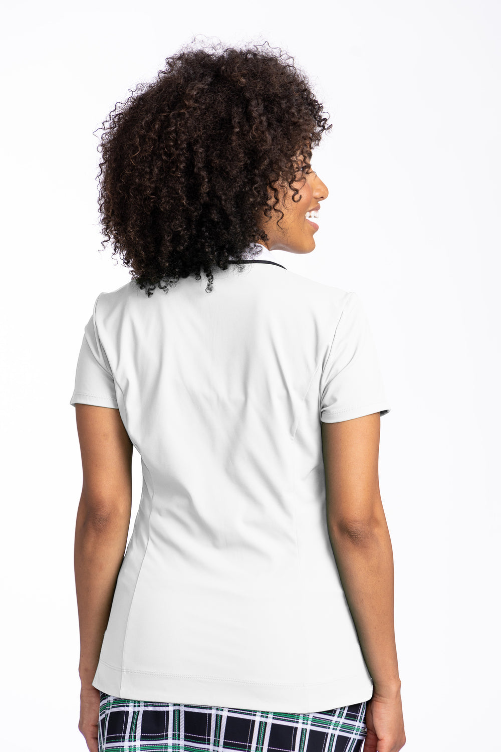 back view of women looking over shoulder in white classic and fantastic polo 