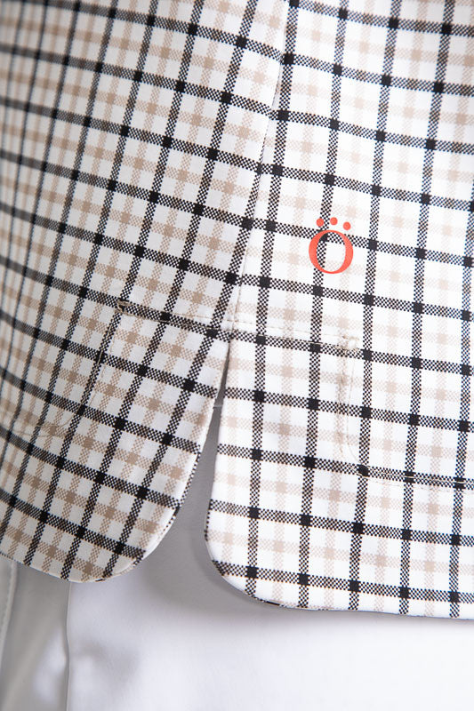 Close right side view of the hemline on the Classic and Fantastic Short Sleeve Golf Top in Quad Squad print.