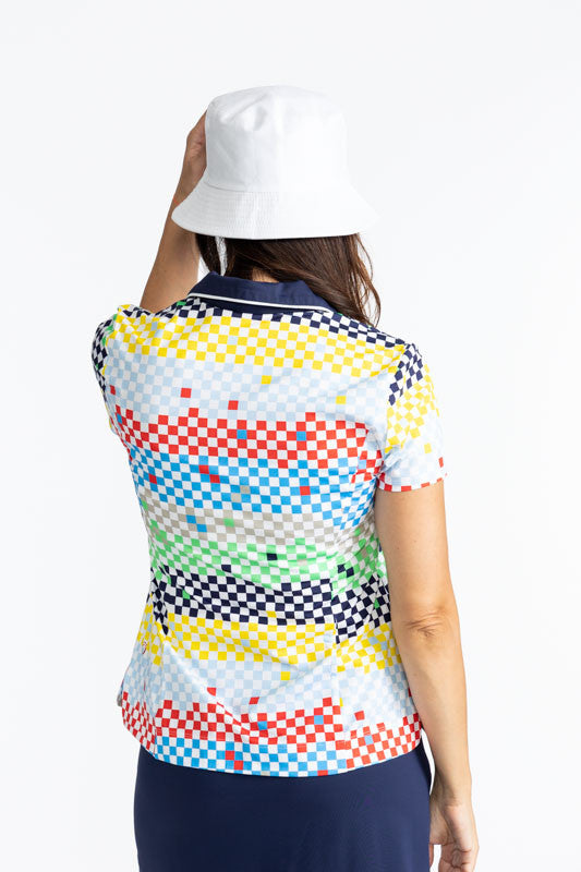 Back view of a woman wearing the Big O Bucket Hat in White and the Classic and Fantastic Short Sleeve Golf Top in Cheeky Check print. This print is made up of a checked horizontal patter that creates a horizontal wrap in black, grass green, lemon yellow, 