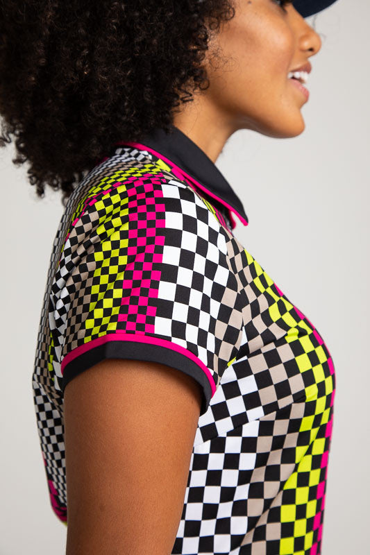 Close right side view of the shoulder on the Play Through Short Sleeve Golf Dress in Checks Mix Print.