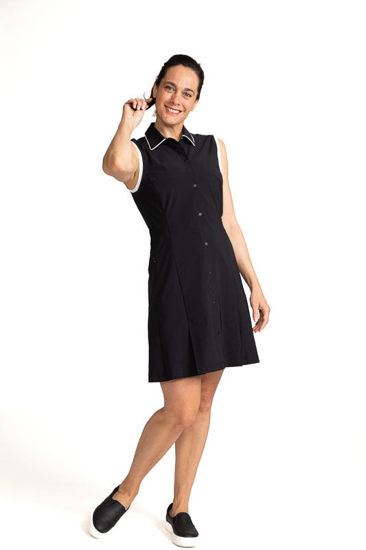 Full front view of a woman golfer wearing the  Coming in Hot Sleeveless Golf Dress in Black.