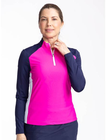 Front view of the Cap to Tap Long Sleeve Golf Top in Open Air Pink. This top is a solid pink top with navy blue sleeves and neckline and white stretch rib sides.