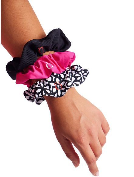 The Super Scrunchie Threesome Black Pack includes one scrunchie in black, pink, and black and white patterned.