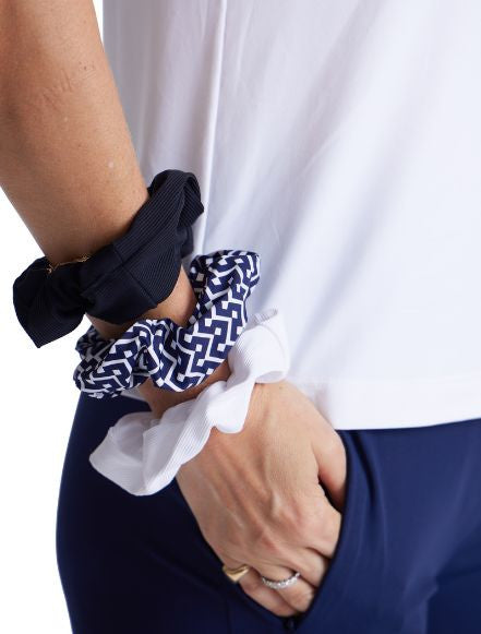 The Super Scrunchie Threesome Navy Blue pack includes one scrunchie in navy blue, one in blue and white patterned, and one in white. 