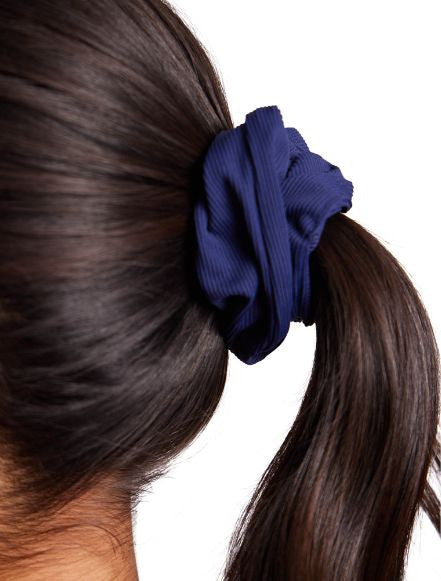 Close up of the navy blue scrunchie in the Super Scrunchie Threesome Navy Blue pack.
