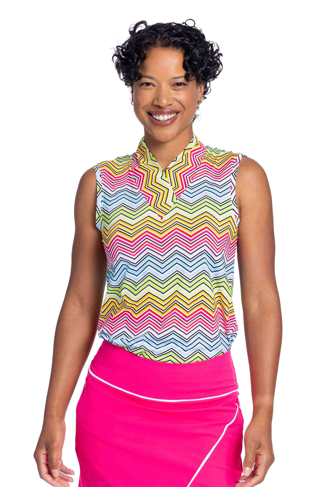 Woman wearing the Light and Lovely Sleeveless Golf Top in Summer Herringbone and bright pink skort
