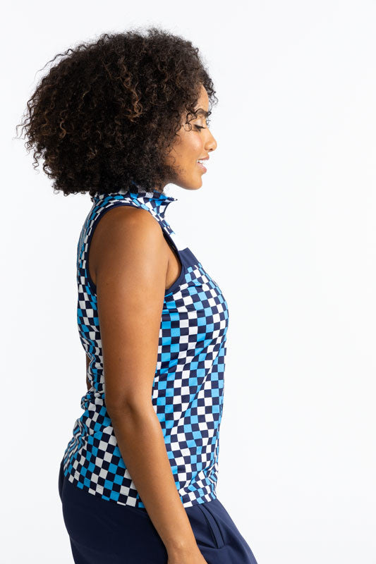 Right side view of the On Target Sleeveless Golf Top in Check It Out print. This print is made up of French blue, navy blue, and white checks forming a vertical pattern and has one thick white stripe and one thick navy blue stripe across the front upper c
