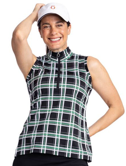 Close front view of a smiling woman wearing the Keep It Covered Sleeveless Golf Top in Tartan Plaid and the We've Got You Covered Hat in White.