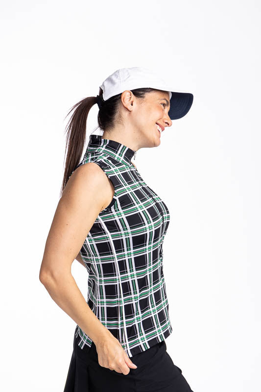 Right side view of the Keep It Covered Sleeveless Golf Top in Tartan Plaid and the We've Got You Covered Hat in White.