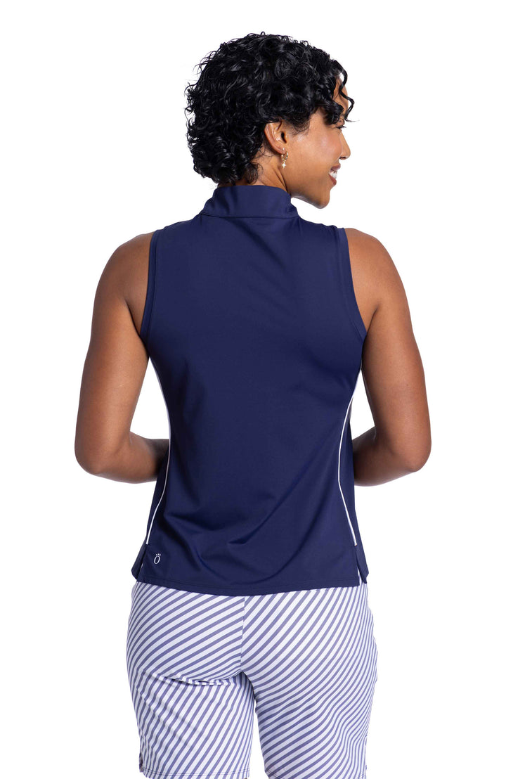 Back view of a woman wearing a Keep It Covered Sleeveless Golf Top in navy blue