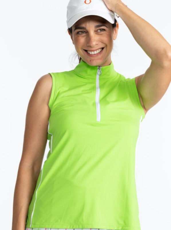 Smiling woman wearing the We've Got You Covered Hat in White and the Keep It Covered Sleeveless Golf Top in Grass Green. This is a solid grass green top with a white quarter zip front and a thin, white stripe down each side of the top. 