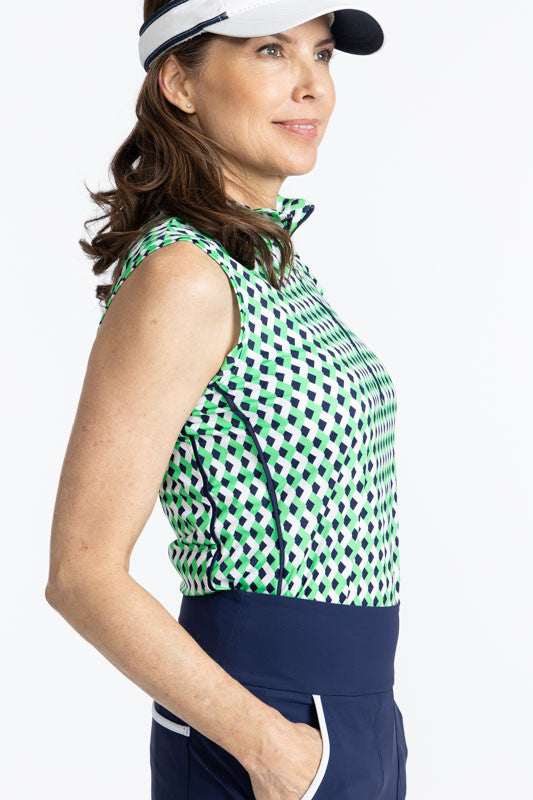 Right side view of the Keep It Covered Sleeveless Golf Top in Chevron Kelly Green. In this view, you can see the armhole and the two thin, navy blue stripes on this side. These are on the other side of this top as well. 