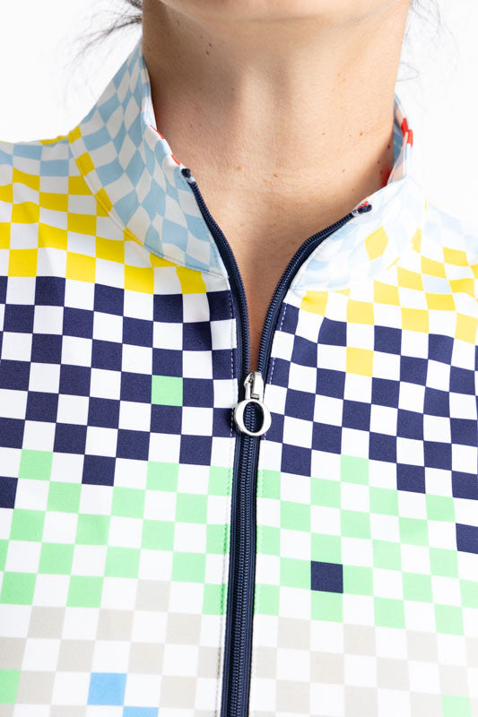Close front view of the quarter zip on the Keep It Covered Sleeveless Golf Top in Cheeky Check Print. This print is made up of a checked horizontal patter that creates a horizontal wrap in black, grass green, lemon yellow, French blue, and tomato red on a