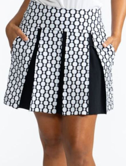 Front view of the Swing and Swirl Golf Skort in Spiral Floral print. This print is a retro style black and white floral pattern. This skort has three black panels tucked in between the front panels of this skort.
