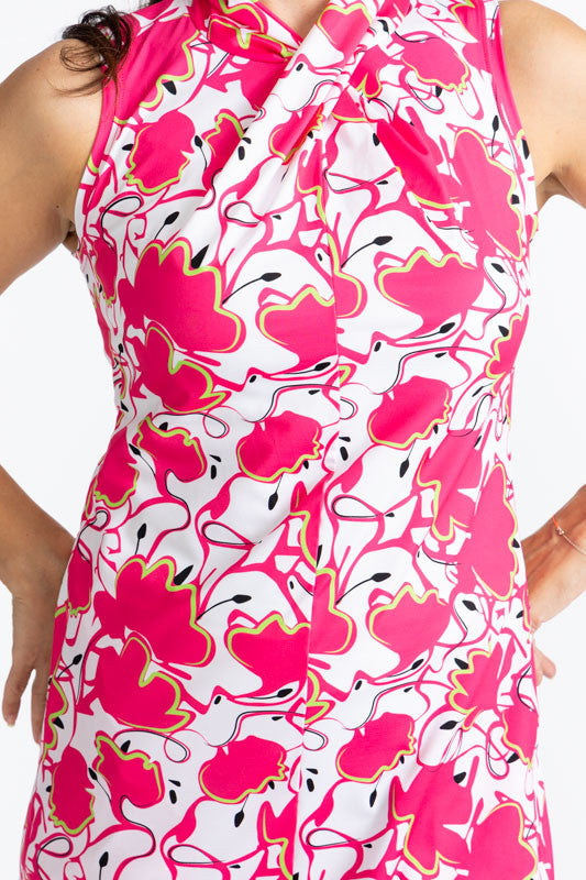Close front view of the neckline on the Twist and Shout Sleeveless Golf Dress in Poppy Power print. This is a retro style hot pink poppy flower on a white background.