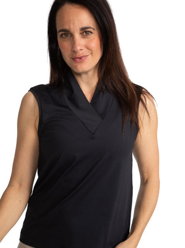 Front view of a smiling woman golfer wearing the Light and Lovely Sleeveless Golf Top in Black.