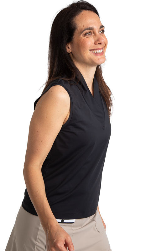Front and right side view of a woman golfer wearing the Light and Lovely Sleeveless Golf Top in Black.