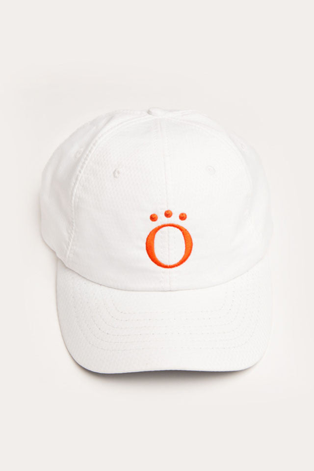 White We've Got You Covered golf baseball-style cap with Kinona logo with adjustable strap and opening for ponytail.